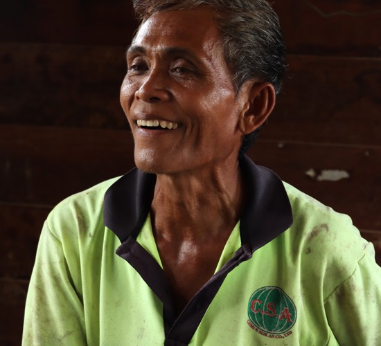 Ouk, a farmer from Cambodia smiles