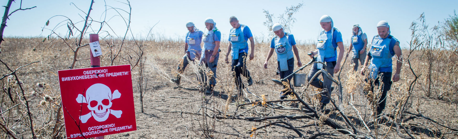 Group of HALO deminers walk through a minefield in Ukraine