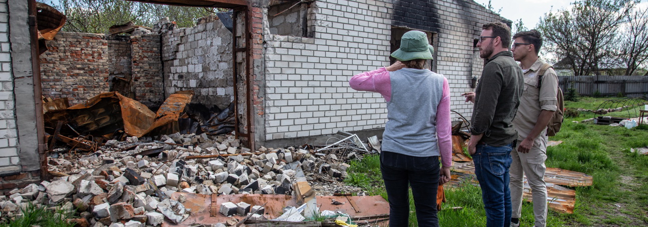 Ukrainian farmer Natalia stands in front of the remnants of her home, after it was bombed by Russian forces