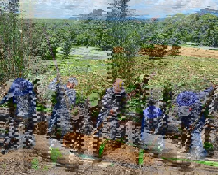 Men moving explosive from ground