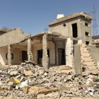 A destroyed building surrounded by rubble in Sirte, Libya