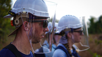 HALO staff wearing visors in the field