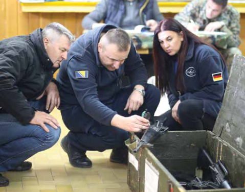 A group of HALO staff carry out weapons marking in the Western Balkans