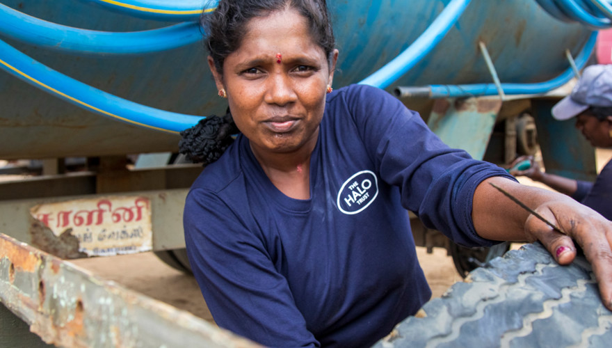 Thavam, who works as a mechanic for HALO holds a tyre outside