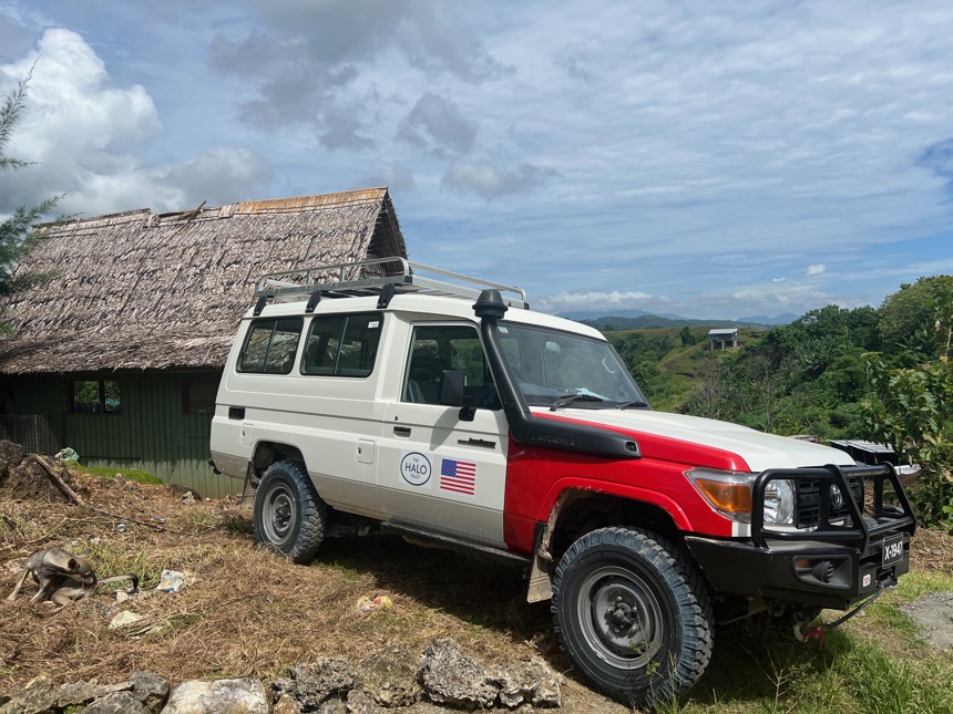 A HALO survey vehicle sits outside a house