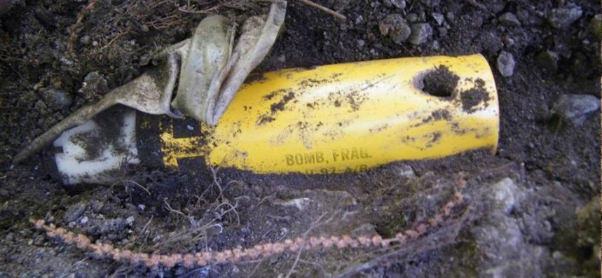 Close up image of a NATO cluster bomb uncovered in the soil in Kosovo
