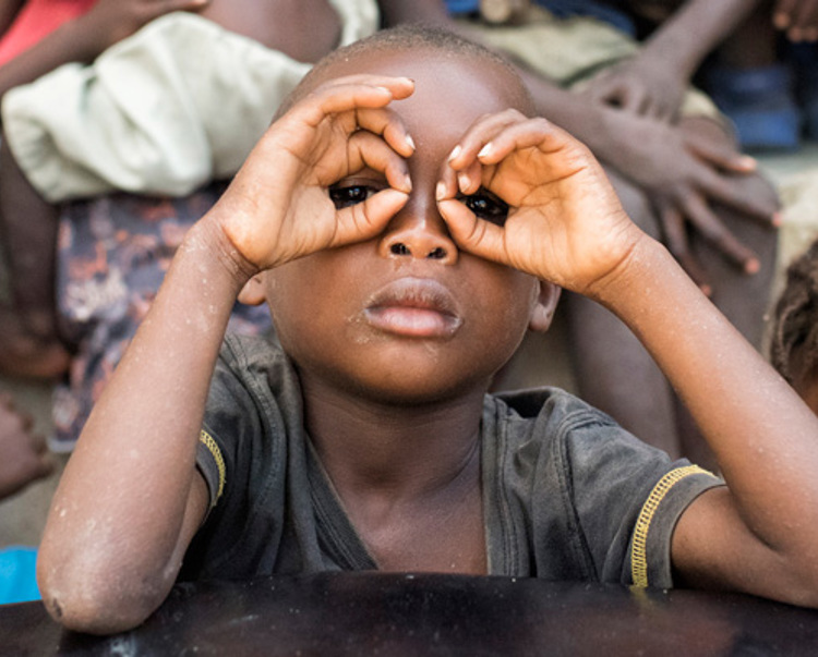 A group of children playing together in Angola