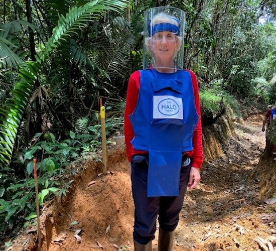 Lucía wears protective gear in a mine marked area