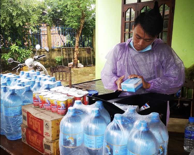 HALO Laos staff sorting through emergency aid