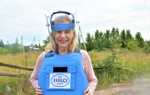 HALO Ambassador Mitzi Perdue smiles while wearing HALO deminer equipment in Ukraine