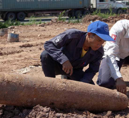 HALO staff member, Phouvanh, working on bomb disposal