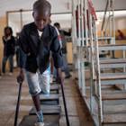 Eight year old Manuel, is missing a leg. He walks on crutches at a rehabilitation centre in Angola