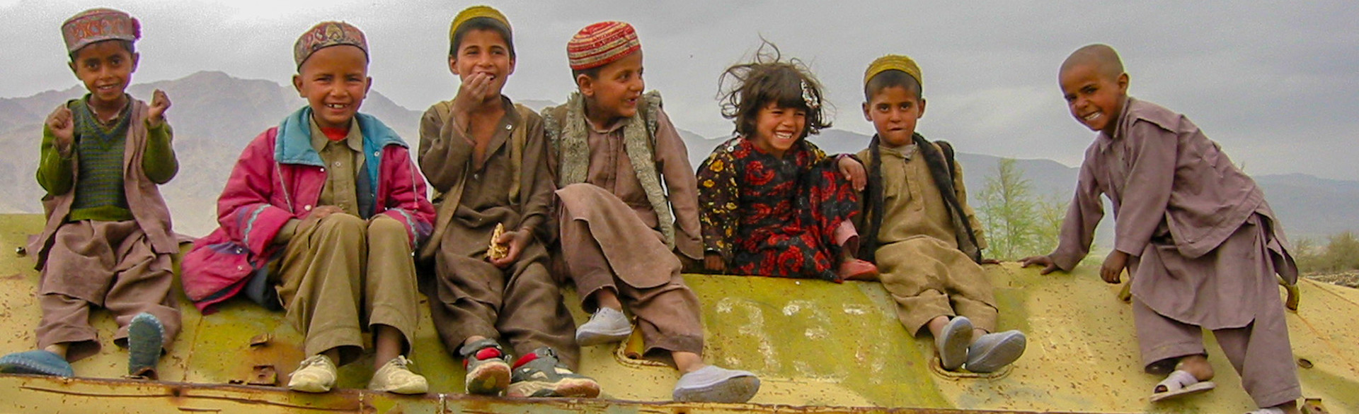 Children sitting and smiling in Afghanistan