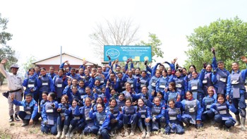 Un Ek smiles with national recruits at HALO's mine clearance training centre in Cambodia