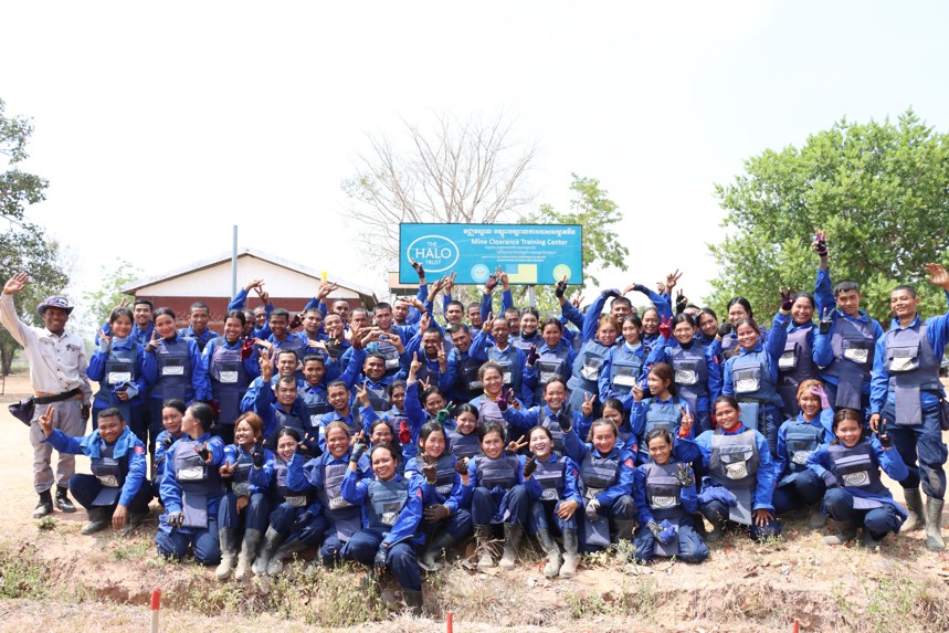 Un Ek smiles with national recruits at HALO's mine clearance training centre in Cambodia
