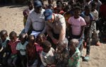 Prince Harry with a group of children in Angola