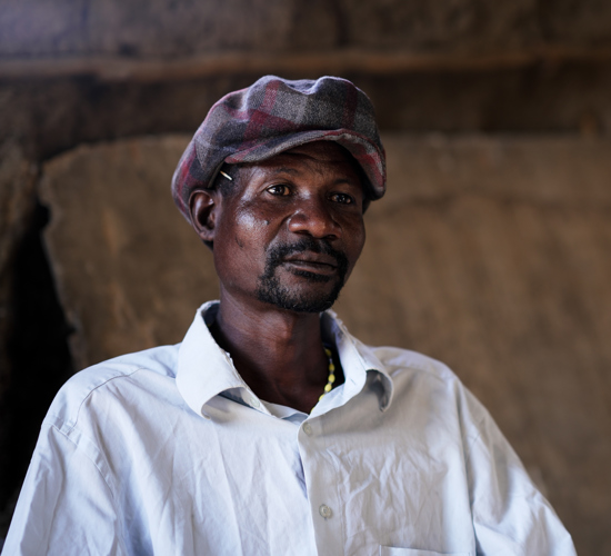 Domingo Correa, a security guard in Benguela sits for a piece to camera