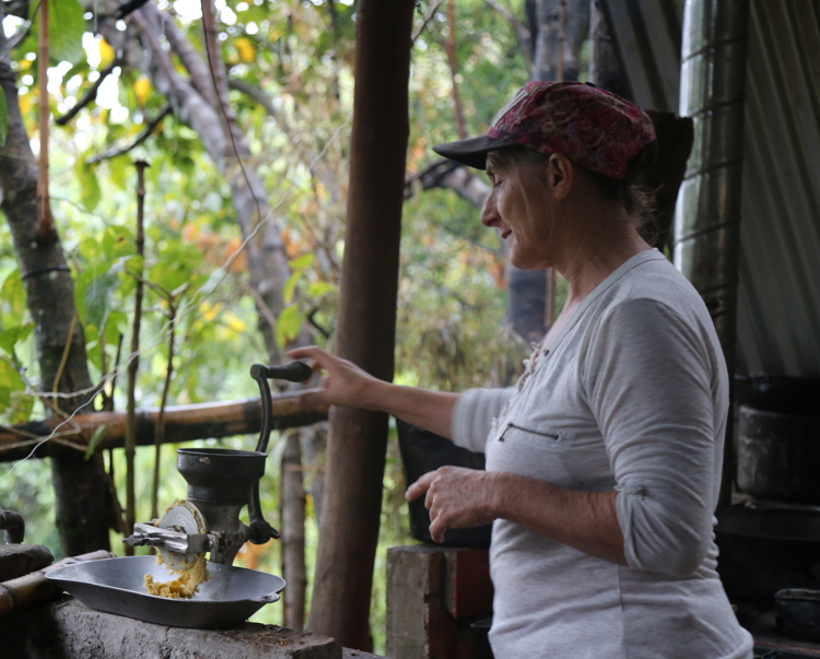 A woman called Blanca Nidia processes coffee on a farm